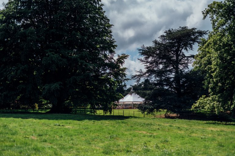 Sailcloth tent in an estate in Yorkshire. High peaks spotted through the trees.