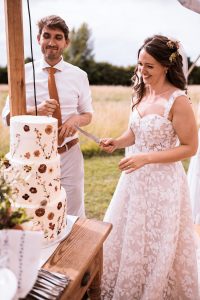 Wedding cake being cut 
