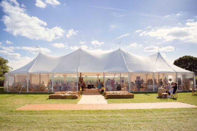 Large Aurora Sailcloth tent with 4 poles for a wedding party.