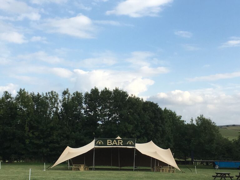 stretch tent used as a bar at a festival